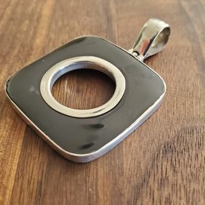 Black shell and silver necklace pendant